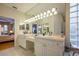 Double vanity bathroom with a large mirror and walk-in shower at 7117 Victoria Circle, University Park, FL 34201