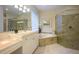 Spa-like bathroom with soaking tub and walk-in shower at 7117 Victoria Circle, University Park, FL 34201