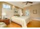 Bright bedroom with hardwood floors and ensuite bathroom access at 7117 Victoria Circle, University Park, FL 34201