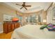 Spacious Primary bedroom with large windows and hardwood floors at 7117 Victoria Circle, University Park, FL 34201