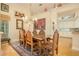 Elegant dining room showcasing a large table and kitchen view at 7117 Victoria Circle, University Park, FL 34201