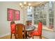 Charming dining area with round table and window seat at 7117 Victoria Circle, University Park, FL 34201