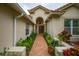 Elegant entryway with double doors and brick walkway at 7117 Victoria Circle, University Park, FL 34201