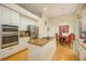 Modern kitchen with stainless steel appliances and breakfast nook at 7117 Victoria Circle, University Park, FL 34201