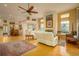 Open concept living space with hardwood floors and fireplace at 7117 Victoria Circle, University Park, FL 34201