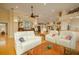 Spacious living room featuring hardwood floors and comfortable seating at 7117 Victoria Circle, University Park, FL 34201