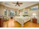 Relaxing main bedroom with hardwood floors and bay window at 7117 Victoria Circle, University Park, FL 34201