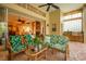 Outdoor patio with seating area and built-in grill; access to interior at 7117 Victoria Circle, University Park, FL 34201