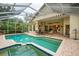 Enclosed pool and spa with patio furniture and awning; views of home at 7117 Victoria Circle, University Park, FL 34201