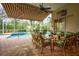 Covered patio overlooks refreshing pool and spa; enjoy outdoor living at 7117 Victoria Circle, University Park, FL 34201