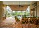 Relaxing pool area with patio furniture, covered lanai, and a built-in grill at 7117 Victoria Circle, University Park, FL 34201