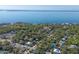 Aerial view of waterfront homes and lush vegetation at 795 40Th St, Sarasota, FL 34234