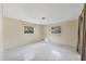 Bedroom with speckled flooring and two windows at 795 40Th St, Sarasota, FL 34234