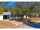 Street view of a ranch home with a carport at 795 40Th St, Sarasota, FL 34234