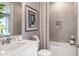 Bathroom with a tub, shower, and white vanity at 8061 Moonbeam Ave, Sarasota, FL 34241