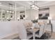 Bright dining room with a table for six and mirrored accent wall at 8061 Moonbeam Ave, Sarasota, FL 34241