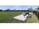 Community dog park offering a bench, waste station, and fenced area for furry friends at 8061 Moonbeam Ave, Sarasota, FL 34241