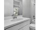 Modern bathroom showcasing white vanity with sleek faucet and white countertop at 8105 Moonbeam Ave, Sarasota, FL 34241