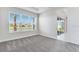 Bedroom featuring carpet flooring and large windows for lots of natural light at 8113 Moonbeam Ave, Sarasota, FL 34241