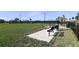 Spacious dog park with a bench for pet owners to relax at 8113 Moonbeam Ave, Sarasota, FL 34241