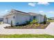 Charming single-story home featuring a brick paver driveway, manicured landscaping and a two-car garage at 8113 Moonbeam Ave, Sarasota, FL 34241