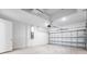Spacious two-car garage featuring a modern door, and ample room for vehicles and storage at 8113 Moonbeam Ave, Sarasota, FL 34241