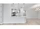 A view of the kitchen, showcasing pendant lighting, modern countertops and stainless steel appliances at 8113 Moonbeam Ave, Sarasota, FL 34241