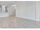 Open-concept living space with views of the kitchen and large tile flooring at 8113 Moonbeam Ave, Sarasota, FL 34241