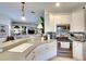 Kitchen with white cabinets, stainless steel appliances, and a large island at 8210 Eagle Isles Pl, Bradenton, FL 34212