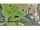 Aerial view of a large lot with two houses and a pond at 8965 Bunker Hill Rd, Duette, FL 34219