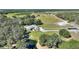 Aerial view of the property featuring a well-maintained home, pond, and pastures at 8965 Bunker Hill Rd, Duette, FL 34219