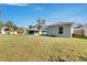 Large backyard with grassy area and partially fenced yard at 1006 Hagle Park Rd, Bradenton, FL 34212