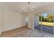 Bright dining room with sliding glass doors leading to a patio and backyard at 1006 Hagle Park Rd, Bradenton, FL 34212