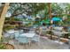 Community BBQ area with grills, tables, and seating at 1200 E Peppertree Ln # 607, Sarasota, FL 34242
