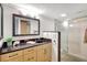 Bathroom features granite vanity and walk-in shower at 1200 E Peppertree Ln # 607, Sarasota, FL 34242
