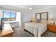 Bright bedroom with a comfortable bed and ocean view at 1200 E Peppertree Ln # 607, Sarasota, FL 34242