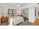 Well-lit bedroom featuring a queen bed and mirrored closet at 1200 E Peppertree Ln # 607, Sarasota, FL 34242