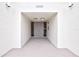 Building entrance with double doors and address number 1200 at 1200 E Peppertree Ln # 607, Sarasota, FL 34242