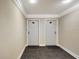 Hallway with two apartment doors and neutral carpeting at 1200 E Peppertree Ln # 607, Sarasota, FL 34242