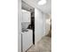 Convenient laundry closet with stackable washer and dryer at 1200 E Peppertree Ln # 607, Sarasota, FL 34242