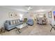Open concept living room and dining area with modern furniture at 1200 E Peppertree Ln # 607, Sarasota, FL 34242