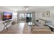 Spacious living room with comfortable seating and a large TV at 1200 E Peppertree Ln # 607, Sarasota, FL 34242