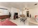 Living room featuring a sofa, TV, and access to adjacent areas at 2003 Princeton Ave, Bradenton, FL 34207