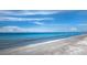 Scenic beach view with footprints in the sand and clear blue water at 2045 Gulf Of Mexico Dr # M1-502, Longboat Key, FL 34228