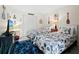 Bedroom with two twin beds and nautical decor at 2045 Gulf Of Mexico Dr # M1-502, Longboat Key, FL 34228