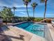 Hot tub with steps, handrails, and tropical landscaping at 2045 Gulf Of Mexico Dr # M1-502, Longboat Key, FL 34228