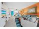 Coastal-themed living room with comfortable seating at 2045 Gulf Of Mexico Dr # M1-502, Longboat Key, FL 34228