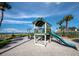 playground with swings, slide, and play area at 2045 Gulf Of Mexico Dr # M1-502, Longboat Key, FL 34228