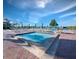 Community pool and spa with lounge chairs and umbrellas, overlooking the beach at 2045 Gulf Of Mexico Dr # M1-502, Longboat Key, FL 34228