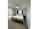 Main bedroom with king-size bed and ceiling fan at 222 27Th W St, Bradenton, FL 34205